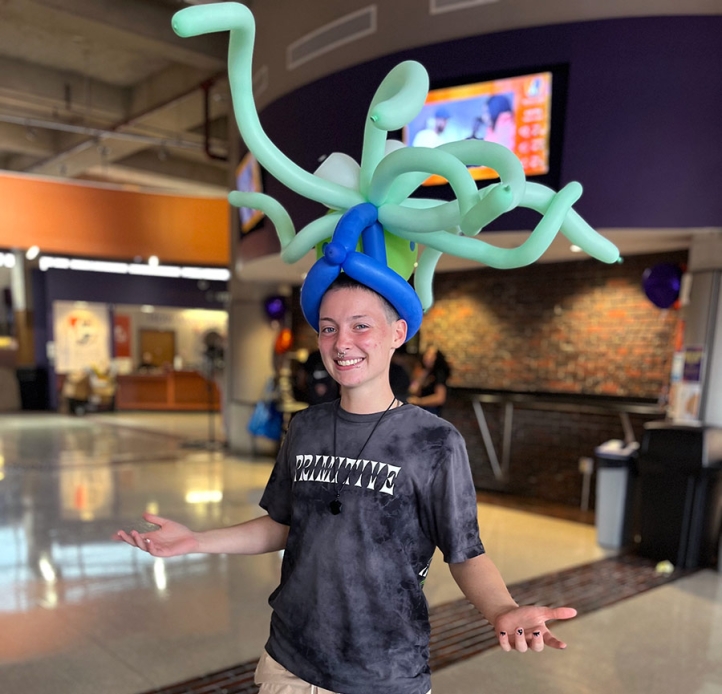 Student wearing a balloon hat.